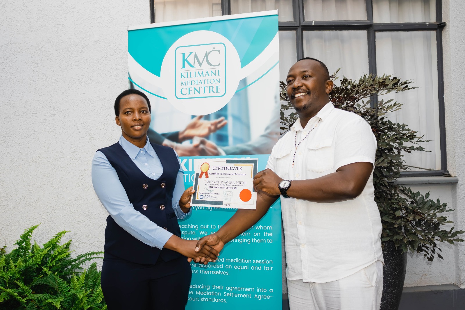 KMC participants celebrating completion of professional mediator training