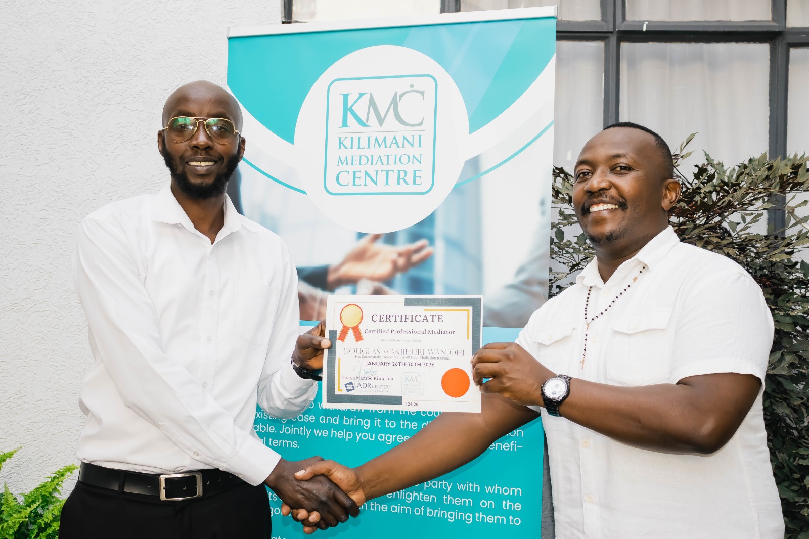 KMC participants celebrating completion of professional mediator training